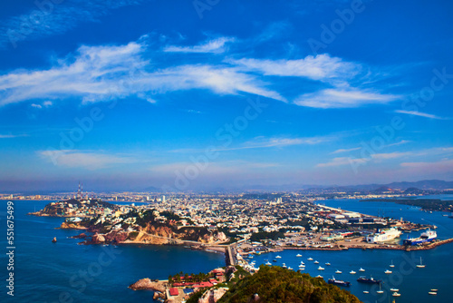 view of a city from the air surrounded by the ocean, city in island, mazatlan sinaloa  photo