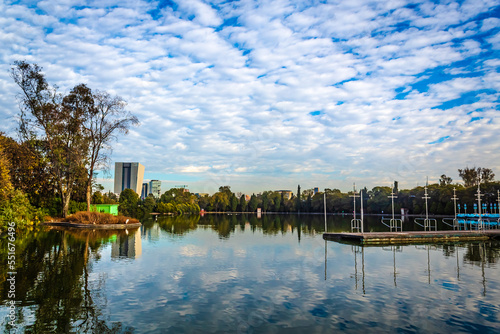 lake with sky full of little clouds and reflection in the water, lake of chapultepec in mexico city © Alex Borderline