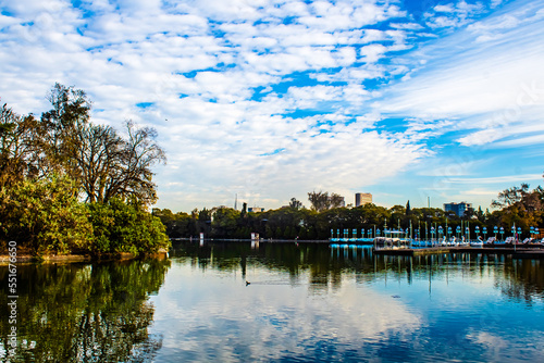 lake in park in a city, reflection in the water of beautiful sky , lake of chapultepec in mexico city  photo