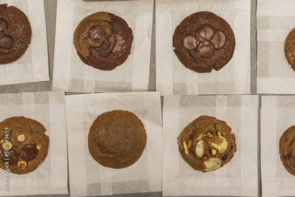 A pile of different flavored chocolate chip cookies viewed from the top A pile of different flavored chocolate chip cookies viewed from the top
