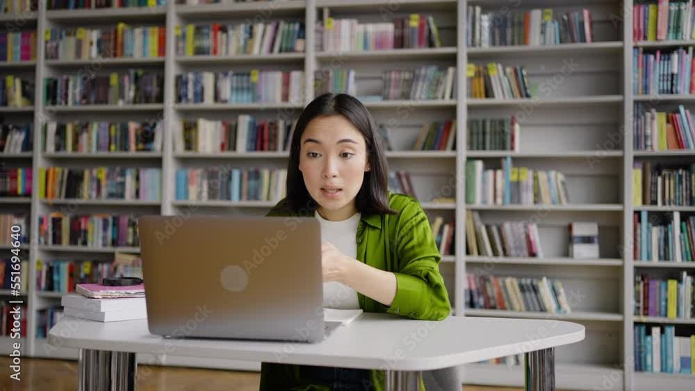 Female student communicates with teacher via video call Female student communicates with teacher via video call