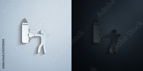 Boxer beats punching bag paper icon with shadow vector illustration