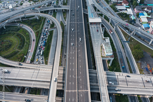 Multilevel junction motorway top view, Road traffic an important infrastructure in Thailand.Expressway Road and Roundabout. Transportation and travel concept.