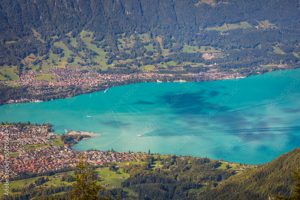 Obraz premium Aerial view of Swiss Alps and Lake Brienz with ferry boat at sunset, Interlaken
