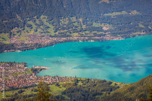 Aerial view of Swiss Alps and Lake Brienz with ferry boat at sunset, Interlaken