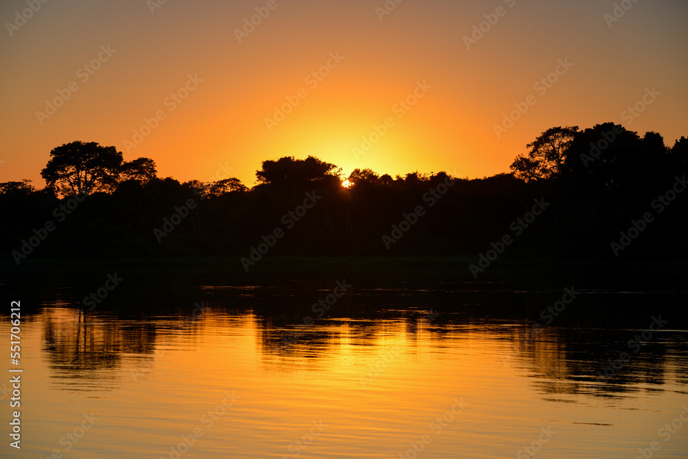 Sunrise on the rainforest-lined Guaporé-Itenez river near the remote village of Remanso, Beni Department, Bolivia, on the border with Rondonia state, Brazil