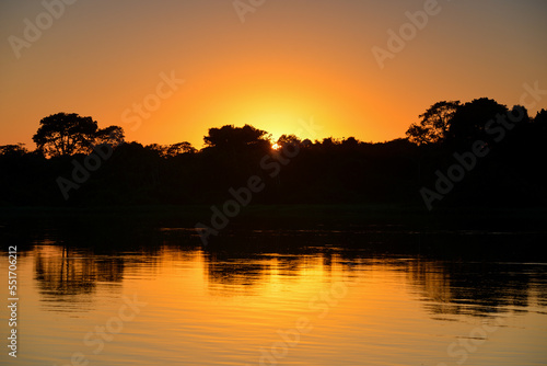 Sunrise on the rainforest-lined Guapor  -Itenez river near the remote village of Remanso  Beni Department  Bolivia  on the border with Rondonia state  Brazil
