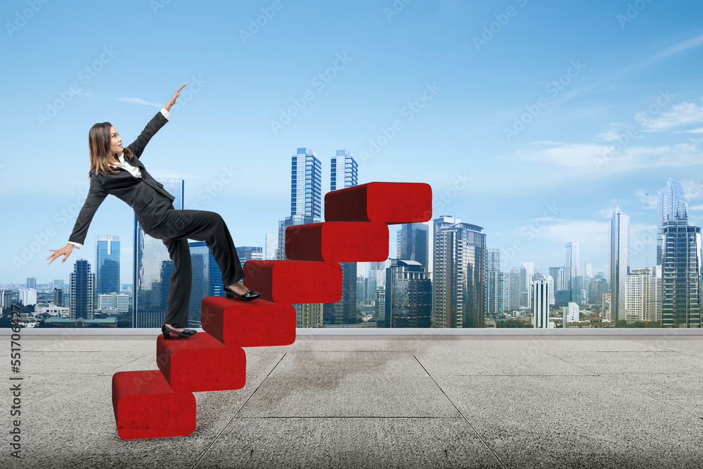 Asian businesswoman climbing stairs Asian businesswoman climbing stairs