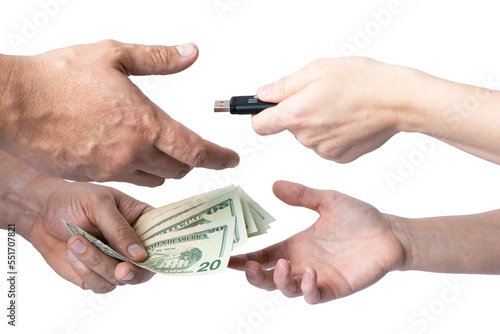 Exchange a storage device for cash between two individuals where only their hands and forearms are visible on a white background.