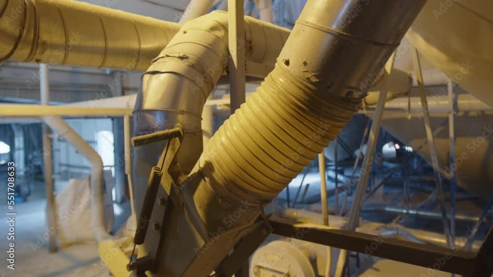 Close-up shot of industrial pipes producing facade materials. Detailed view of automotive manufacturing with modern, technical equipment. High quality 4k footage Close-up shot of industrial pipes producing facade materials. Detailed view of automotive manufacturing with modern, technical equipment. High quality 4k footage