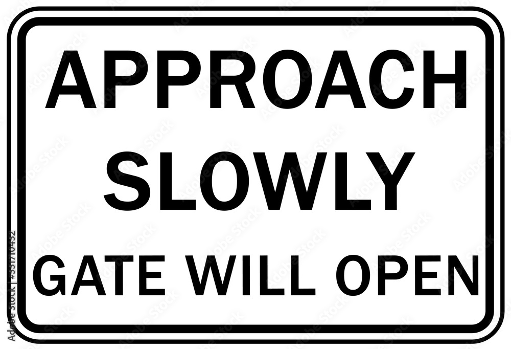 Fototapeta premium Automatic gate warning sign and label approach slowly automatic gate will open