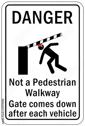 Automatic gate warning sign and label not a pedestrian walkway, gate comes down after each vehicle