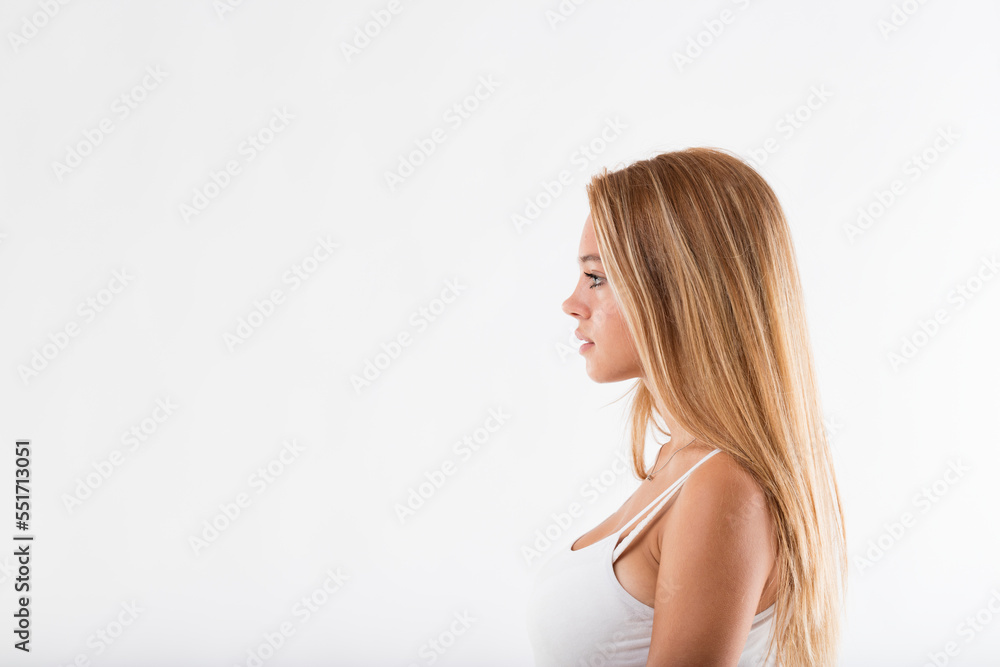 Fototapeta premium Copyspace on the left, blonde girl on the right looking at it