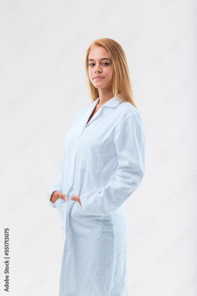 Three-quarter portrait of young blond woman in white coat Three-quarter portrait of young blond woman in white coat