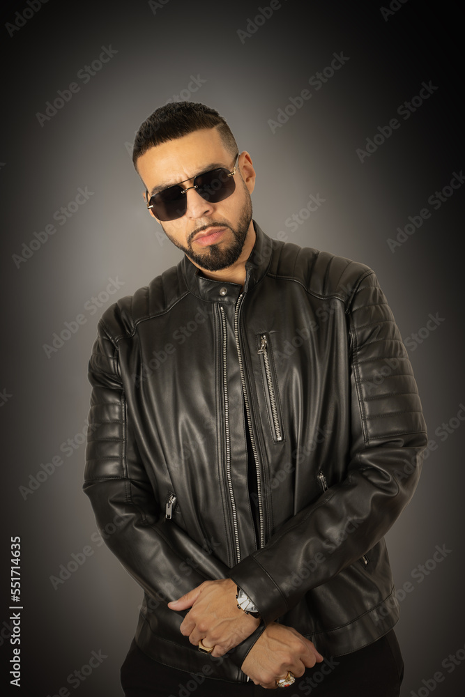 standing up with leather jacket and sunglasses on standing up with leather jacket and sunglasses on