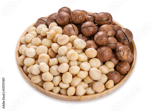 Macadamia nuts and Macadamia with hard shell on wooden background isolate on white with clipping path.