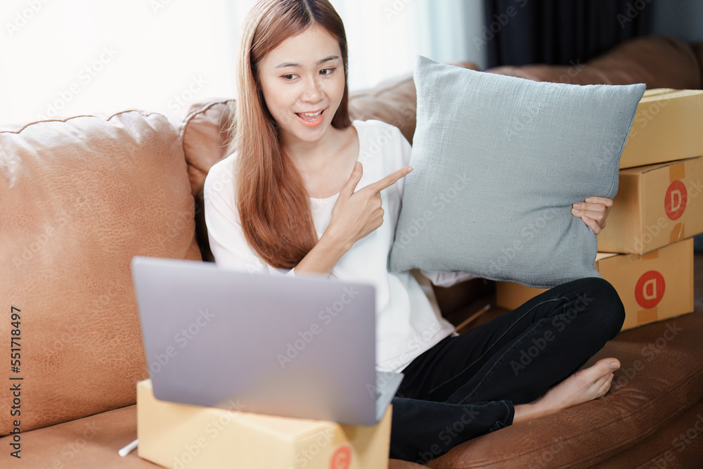 Starting small business entrepreneur of independent young Asian woman online seller using a computer showing products to a customer before making a purchase decision. SME delivery concept Starting small business entrepreneur of independent young Asian woman online seller using a computer showing products to a customer before making a purchase decision. SME delivery concept