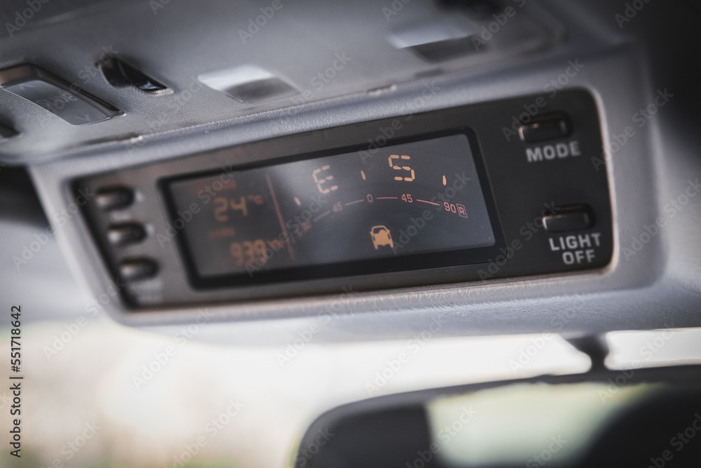 Old navigation system with compass in SUV car. Old navigation system with compass in SUV car.