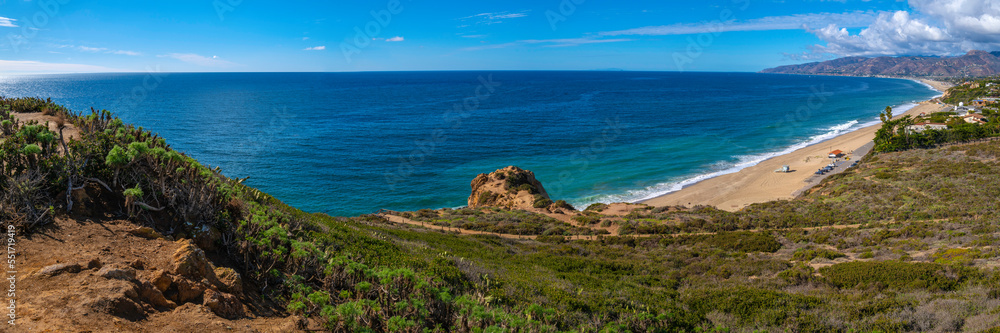 Panoramic Point Dume promontory seascape of Zuma Beach, Malibu, California, with views of the Pacific Ocean, blue horizon