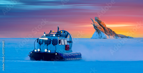 Bilde på lerret Hovercraft rides on Lake Baikal ice at sunset - Ogoy island on winter Baikal lak