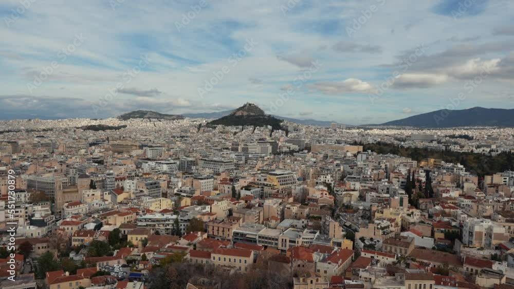 4K aerial video from Acropolis Hill in Athens, Greece during a beautiful sunny day, with wide angle view with the entire city. Greek landmarks filming. 4K aerial video from Acropolis Hill in Athens, Greece during a beautiful sunny day, with wide angle view with the entire city. Greek landmarks filming.