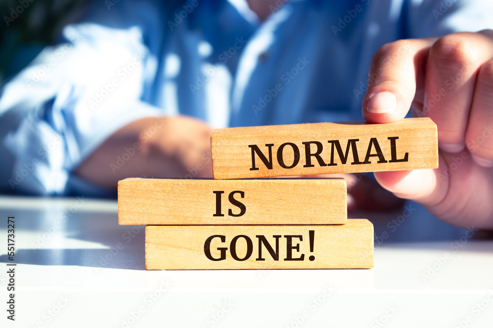 Wooden blocks with words 'Normal is gone'.