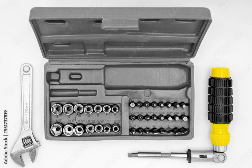 small set of tools in a case with a screwdriver with removable bits and a ratchet wrench small set of tools in a case with a screwdriver with removable bits and a ratchet wrench