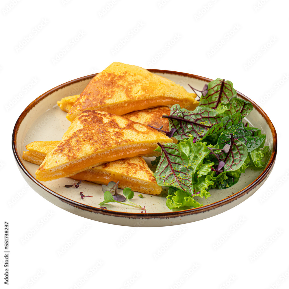 Portion of roast egg toast with cheese and green salad Portion of roast egg toast with cheese and green salad