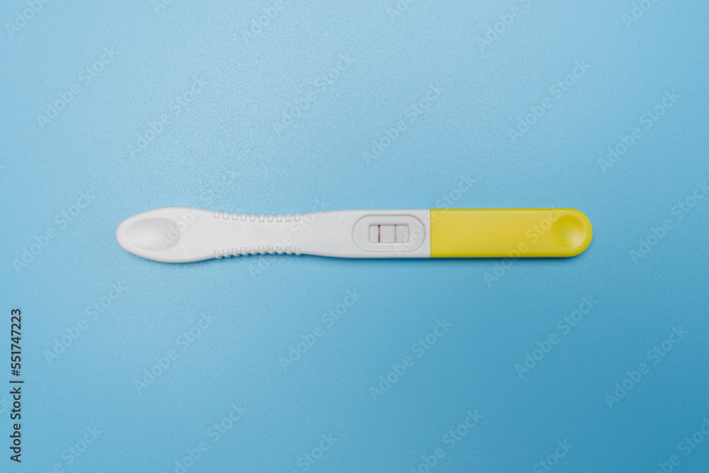 a pregnancy test on a blue background a pregnancy test on a blue background
