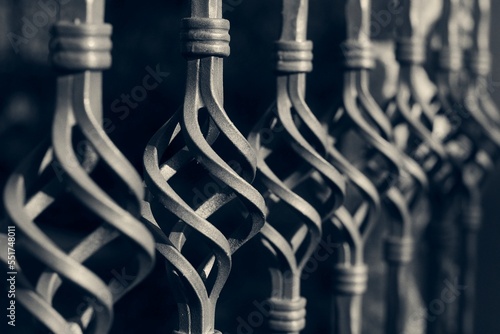 Black wrought iron front garden. Metal fence made of forged steel. Close up. 