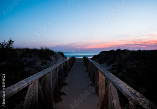 Access walkway to the beach at dusk.