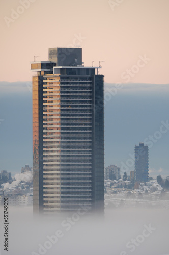 A thick fog blanket covering Metro Vancouver on a winter morning during sunrise in Burnaby, British Columbia, Canada photo