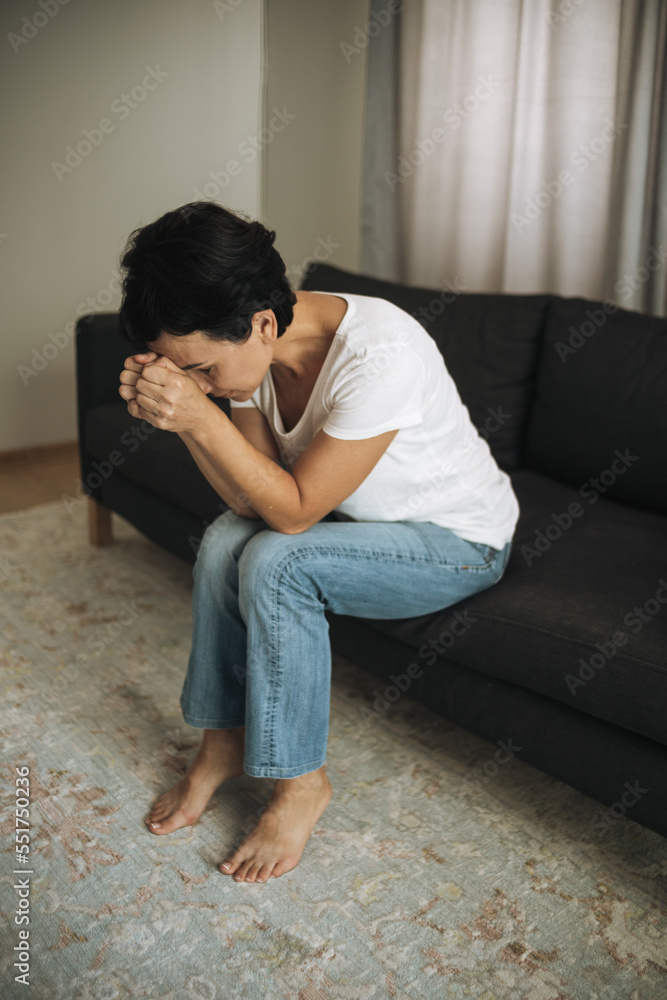 Woman is crying closing her face with hands. Woman in depression. Domestic violence and divorce Woman is crying closing her face with hands. Woman in depression. Domestic violence and divorce