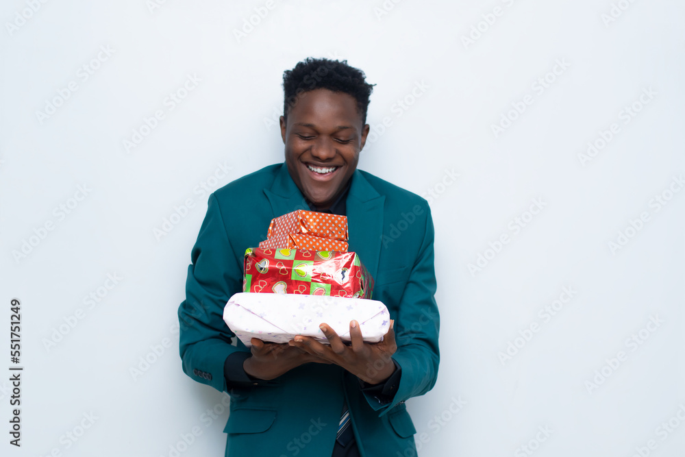 young african man happy with gifts in his hand