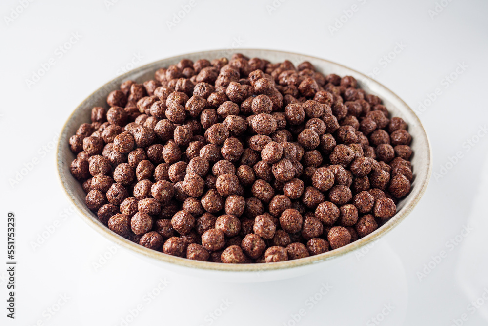 sweet crunchy chocolate children's breakfast chocolate balls on a white background sweet crunchy chocolate children's breakfast chocolate balls on a white background