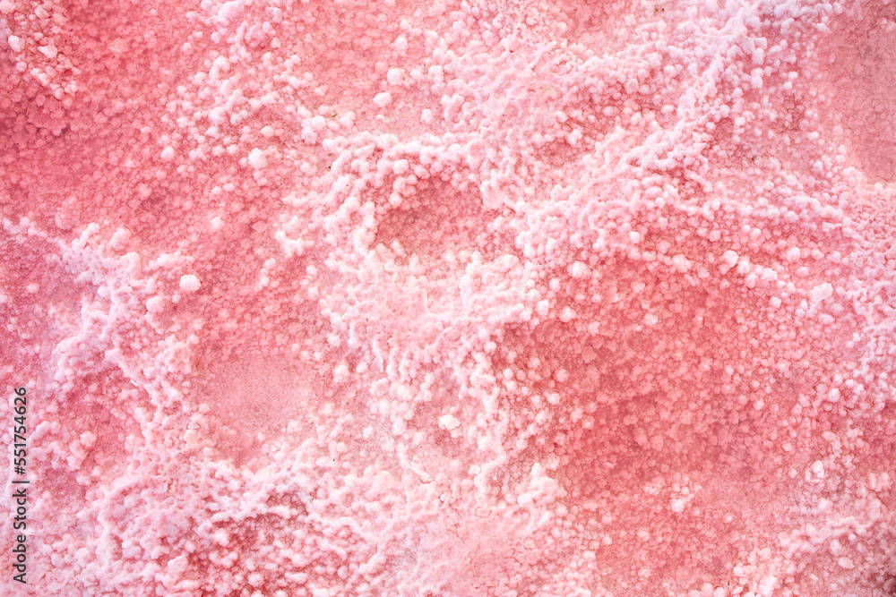 Pink lake - texture of pink salt as a background, unusual nature. A unique rare natural phenomenon. Salt lake with pink algae. Beautiful landscape.