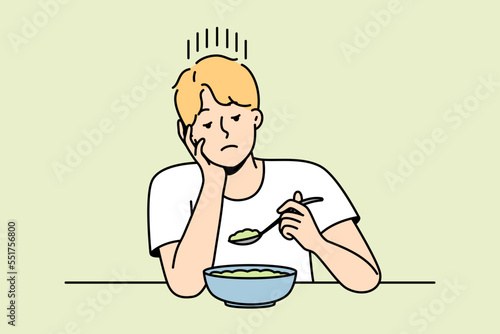Guy without appetite looks at lean soup or salad made from vegetables. Man follows diet prescribed by doctor. Boy sadly eating vegetarian dish. Vector contour line colorful isolated illustration.