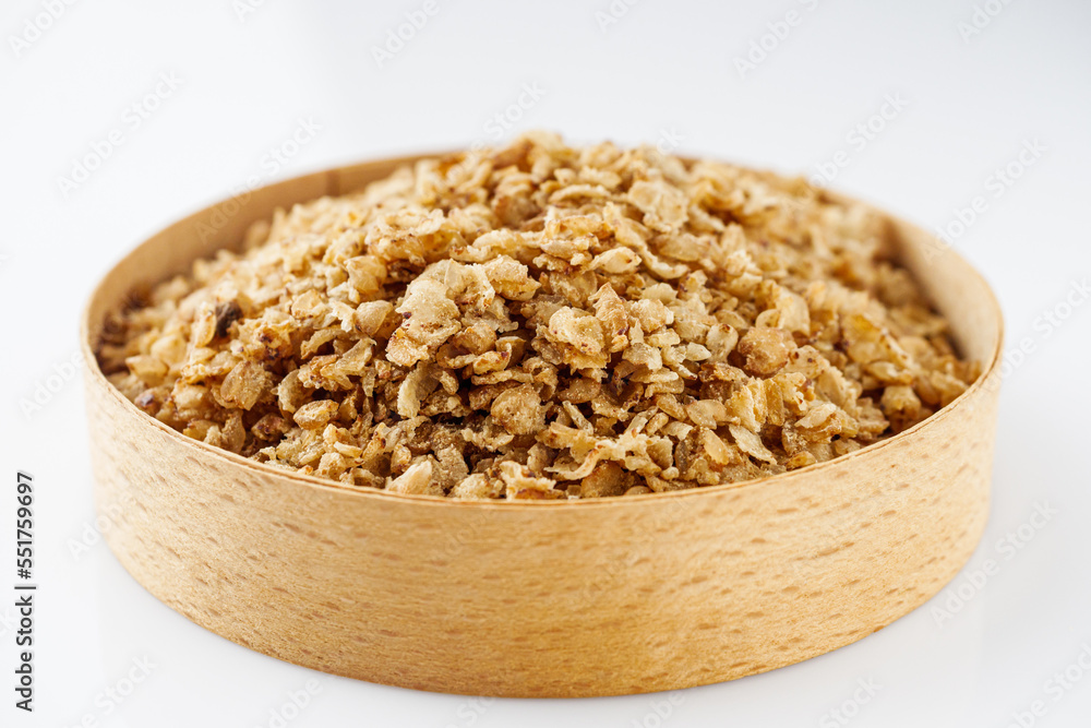 fresh raw buckwheat flakes on a white background fresh raw buckwheat flakes on a white background