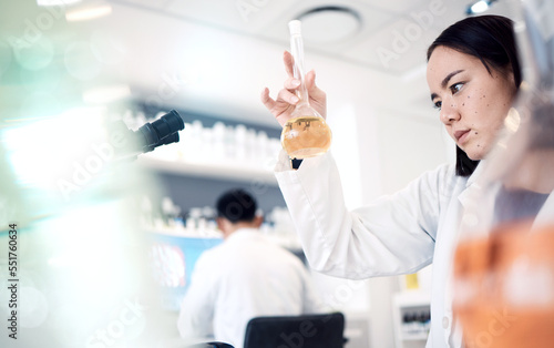 Science, research and woman with liquid in test tube for analysis, medical testing and analytics in lab. Biotechnology, healthcare and female scientist with medicine, sample and vaccine in glass vial