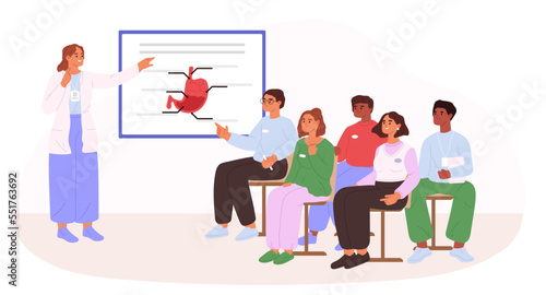 Medical college students listening to doctor lecture in classroom. Audience of people study stomach