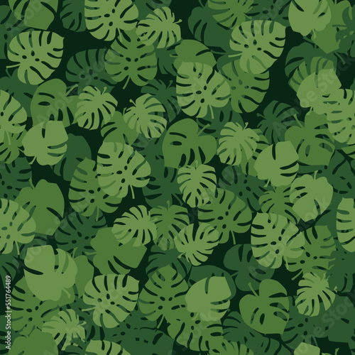 Seamless vector pattern of green leaves on a dark green background. Calm and pleasant pattern for eco-business