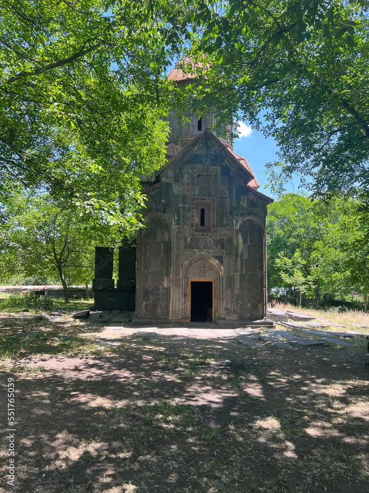 Small little monastery between trees in Armenia Small little monastery between trees in Armenia