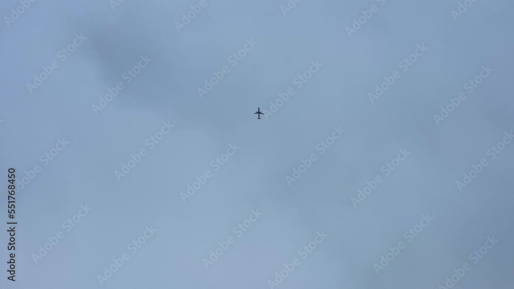 Fighter Jet Flying Over The City Above The blue sky. Ready For Air Attack. Fighter Jet Flying Over The City Above The blue sky. Ready For Air Attack.