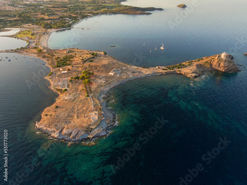 Top view with drone of Nora archaeological site at sunset Sardinia, Italy. Ancient Roman ruins in Nora, near Pula in Sardinia, Italy