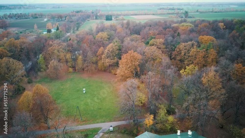 Eleja Manor Park and Tea House in Autumn. The Manor Complex Was Designed in the Beginning of the 19th Century in the Style of the Classicism. Aerial Dron Shot. The Castles Old Brick Walls photo