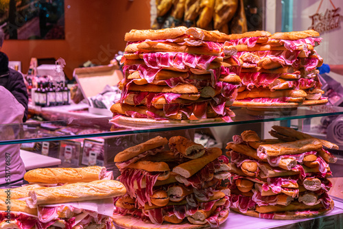 Zorita shop offering spanish traditional meat called 'Hamon' on Marqués de Larios street in Malaga, Spain on December 3, 2022 photo