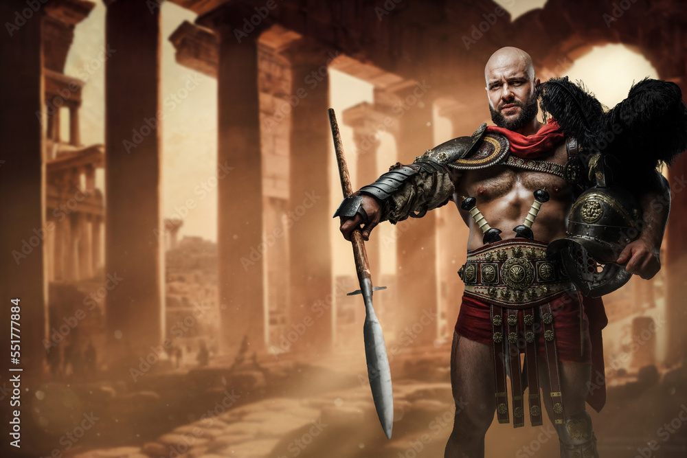Shot of roman gladiator with naked torso holding long spear and plumed helmet on ruins.