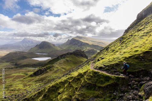 Obraz na płótnie Woman hiking on Quiraing.It is a geological formation on the Scottish Isle of Skye and a hiker's paradise w salonie
