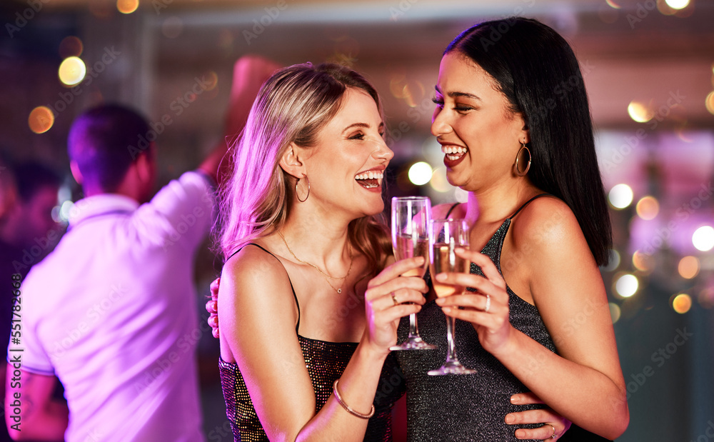 Party, champagne and lesbian couple toast at nightclub, having fun and bonding. Celebration, cheers and happy women with wine or alcohol at new year event, laughing or enjoying quality time together.