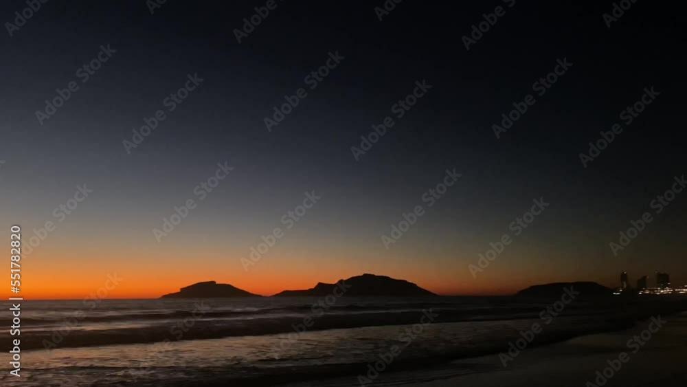 Mazatlan Sinaloa beach at night with luminous city in the background Mazatlan Sinaloa beach at night with luminous city in the background